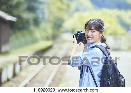 Stock Photo - Young Japanese woman traveling in Kyoto. Fotosearch