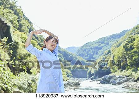 Stock Photo - Young Japanese woman traveling in Kyoto. Fotosearch