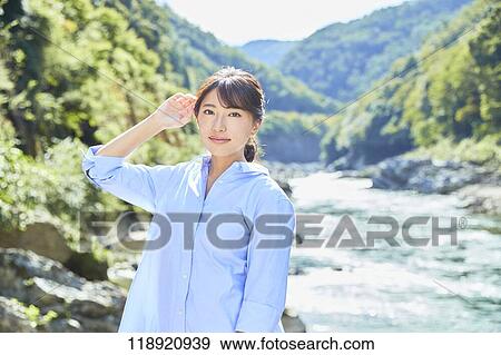 Stock Photo - Young Japanese woman traveling in Kyoto. Fotosearch