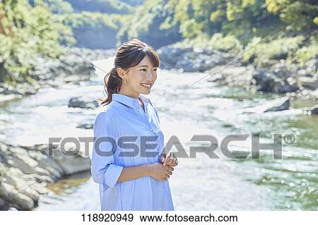Stock Photo - Young Japanese woman traveling in Kyoto. Fotosearch