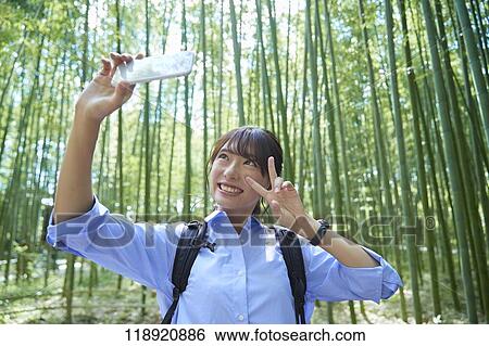 Stock Photograph - Young Japanese woman traveling in Kyoto. Fotosearch