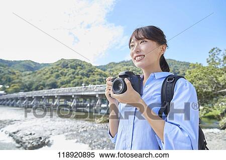 Young Japanese woman traveling in Kyoto View Large Photo Image Stock Photography - Young Japanese woman traveling in Kyoto. Fotosearch