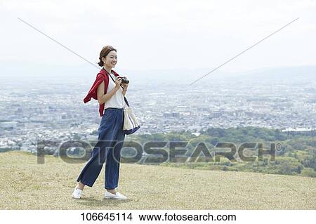 Young Japanese woman visiting Nara View Large Photo Image Picture - Young Japanese woman visiting Nara. Fotosearch