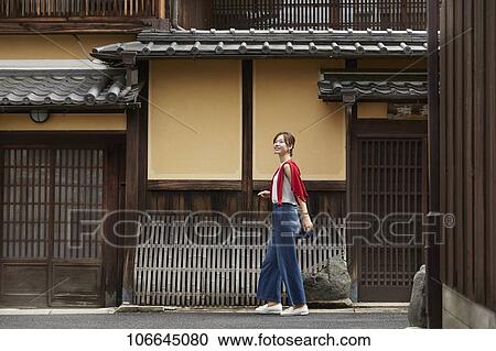 Young Japanese woman visiting Nara View Large Photo Image Stock Image - Young Japanese woman visiting Nara. Fotosearch