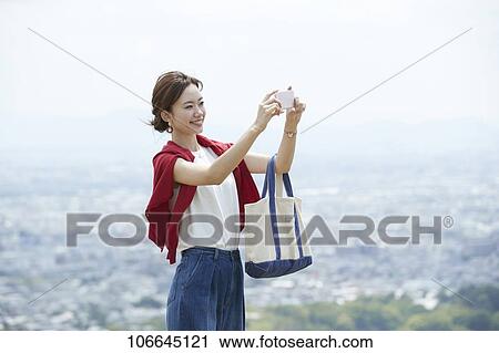 Young Japanese woman visiting Nara View Large Photo Image Stock Image - Young Japanese woman visiting Nara. Fotosearch