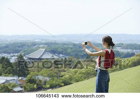 Young Japanese woman visiting Nara View Large Photo Image Stock Image - Young Japanese woman visiting Nara. Fotosearch