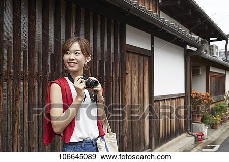 Young Japanese woman visiting Nara View Large Photo Image Stock Photo - Young Japanese woman visiting Nara. Fotosearch