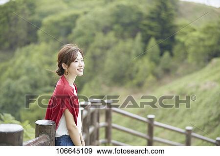 Stock Photo - Young Japanese woman visiting Nara. Fotosearch