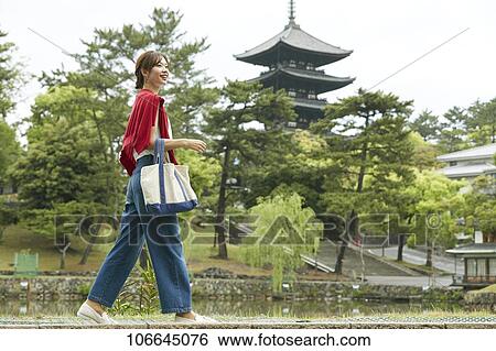 Young Japanese woman visiting Nara View Large Photo Image Stock Photograph - Young Japanese woman visiting Nara. Fotosearch