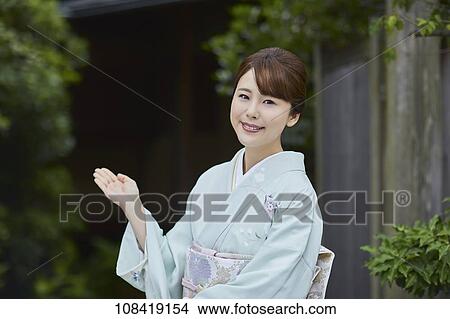 Young Japanese woman wearing traditional kimono View Large Photo Image Picture - Young Japanese woman wearing traditional kimono. Fotosearch