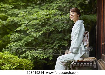 Young Japanese woman wearing traditional kimono View Large Photo Image Picture - Young Japanese woman wearing traditional kimono. Fotosearch
