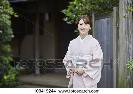 Picture - Young Japanese woman wearing traditional kimono. Fotosearch