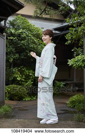 Young Japanese woman wearing traditional kimono View Large Photo Image Picture - Young Japanese woman wearing traditional kimono. Fotosearch