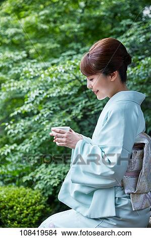 Young Japanese woman wearing traditional kimono View Large Photo Image Picture - Young Japanese woman wearing traditional kimono. Fotosearch
