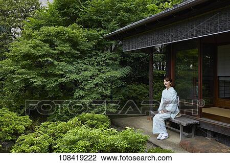 Stock Image - Young Japanese woman wearing traditional kimono. Fotosearch