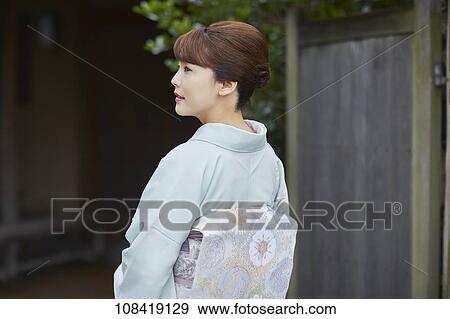 Stock Photo - Young Japanese woman wearing traditional kimono. Fotosearch