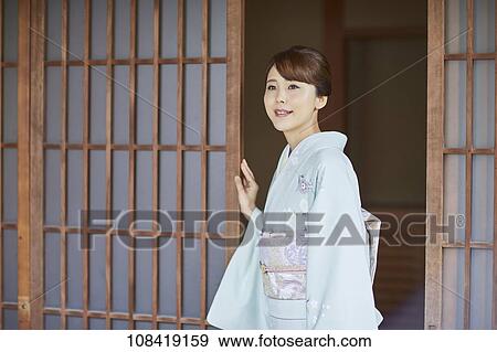 Stock Photo - Young Japanese woman wearing traditional kimono. Fotosearch