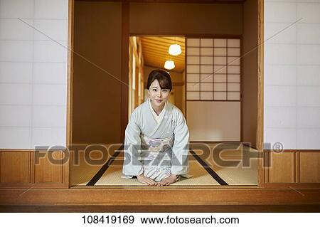 Young Japanese woman wearing traditional kimono View Large Photo Image Stock Photo - Young Japanese woman wearing traditional kimono. Fotosearch