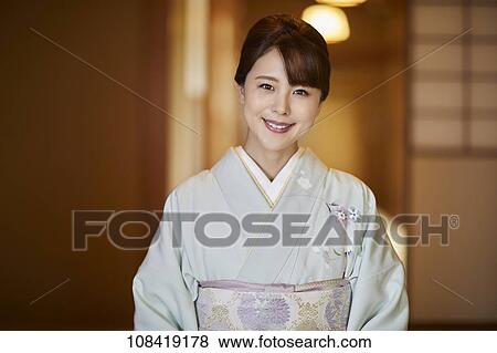 Stock Photo - Young Japanese woman wearing traditional kimono. Fotosearch