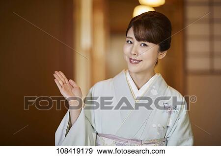 Young Japanese woman wearing traditional kimono View Large Photo Image Stock Photo - Young Japanese woman wearing traditional kimono. Fotosearch