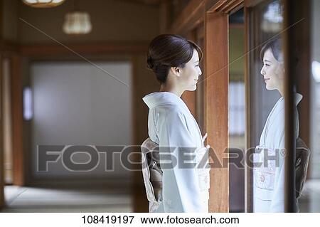 Stock Photo - Young Japanese woman wearing traditional kimono. Fotosearch