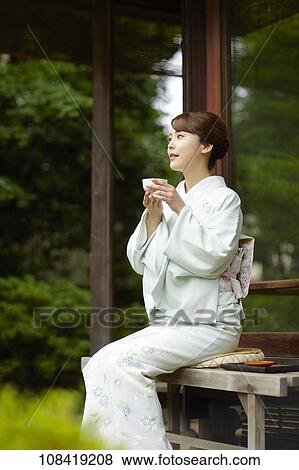 Stock Photo - Young Japanese woman wearing traditional kimono. Fotosearch