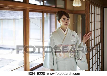 Stock Photo - Young Japanese woman wearing traditional kimono. Fotosearch