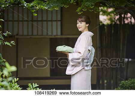 Stock Photo - Young Japanese woman wearing traditional kimono. Fotosearch