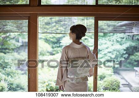 Stock Photo - Young Japanese woman wearing traditional kimono. Fotosearch