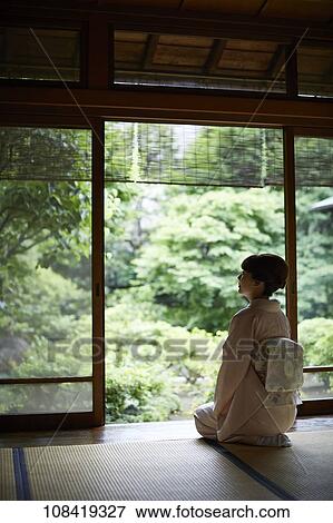 Young Japanese woman wearing traditional kimono View Large Photo Image Stock Photo - Young Japanese woman wearing traditional kimono. Fotosearch
