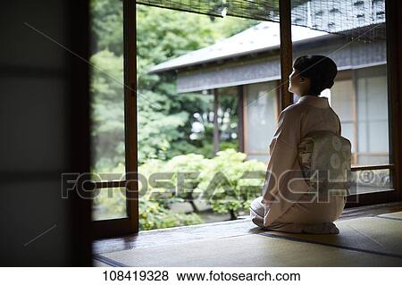 Stock Photo - Young Japanese woman wearing traditional kimono. Fotosearch