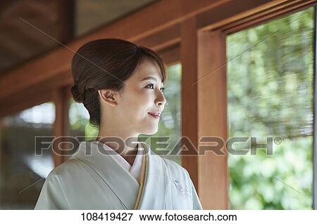 Stock Photo - Young Japanese woman wearing traditional kimono. Fotosearch