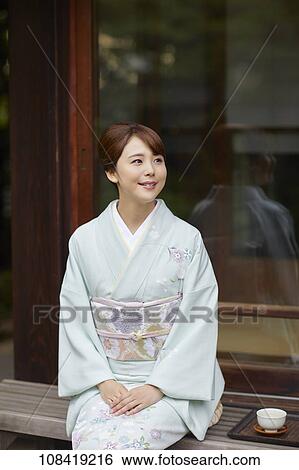 Stock Photograph - Young Japanese woman wearing traditional kimono. Fotosearch
