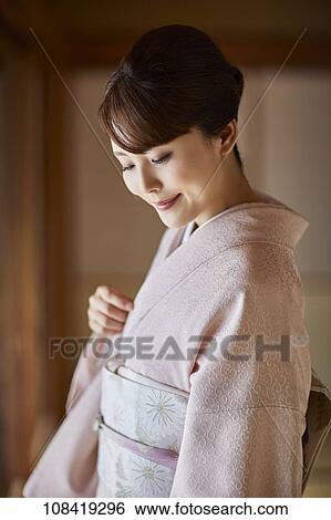 Stock Photograph - Young Japanese woman wearing traditional kimono. Fotosearch