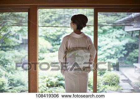 Stock Photograph - Young Japanese woman wearing traditional kimono. Fotosearch