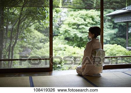 Stock Photograph - Young Japanese woman wearing traditional kimono. Fotosearch