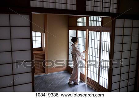 Young Japanese woman wearing traditional kimono View Large Photo Image Stock Photograph - Young Japanese woman wearing traditional kimono. Fotosearch