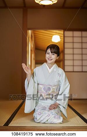 Young Japanese woman wearing traditional kimono View Large Photo Image Stock Photography - Young Japanese woman wearing traditional kimono. Fotosearch