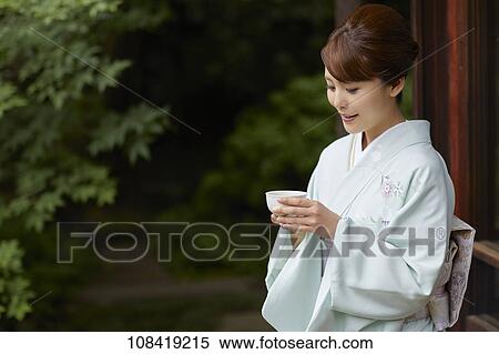 Stock Photography - Young Japanese woman wearing traditional kimono. Fotosearch