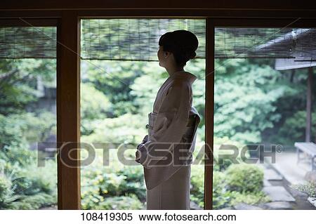 Young Japanese woman wearing traditional kimono View Large Photo Image Stock Photography - Young Japanese woman wearing traditional kimono. Fotosearch