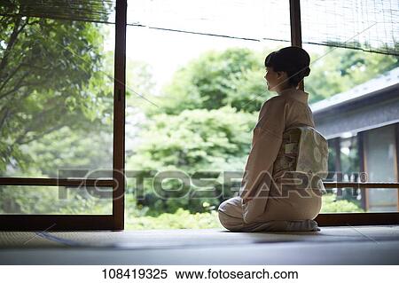 Stock Photography - Young Japanese woman wearing traditional kimono. Fotosearch