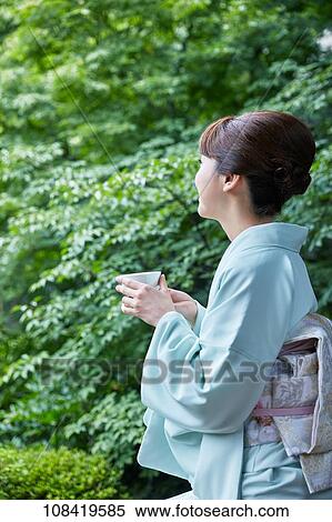 Stock Photography - Young Japanese woman wearing traditional kimono. Fotosearch