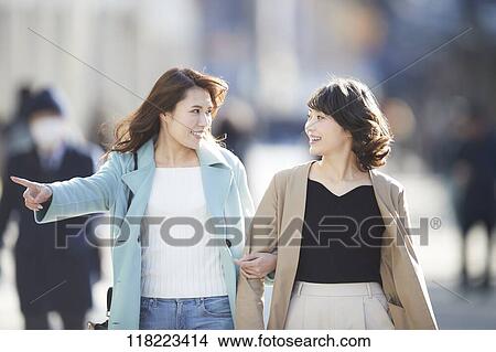 Picture - Young Japanese women downtown Tokyo. Fotosearch
