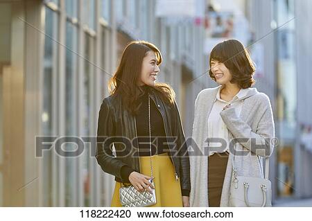 Stock Image - Young Japanese women downtown Tokyo. Fotosearch