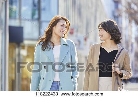 Stock Image - Young Japanese women downtown Tokyo. Fotosearch