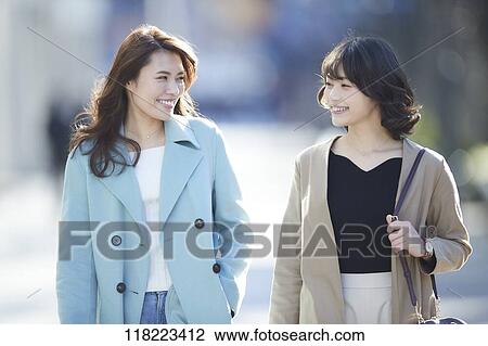 Stock Image - Young Japanese women downtown Tokyo. Fotosearch