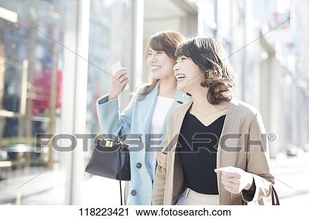 Stock Image - Young Japanese women downtown Tokyo. Fotosearch