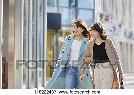 Stock Photo - Young Japanese women downtown Tokyo. Fotosearch