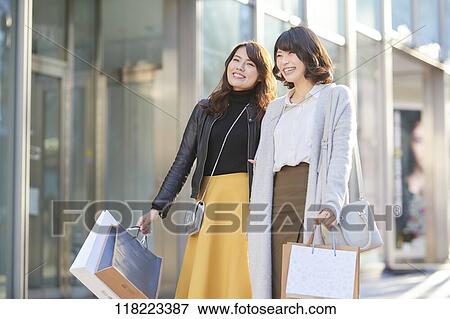 Young Japanese women downtown Tokyo View Large Photo Image Stock Photo - Young Japanese women downtown Tokyo. Fotosearch