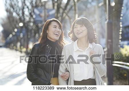Stock Photo - Young Japanese women downtown Tokyo. Fotosearch